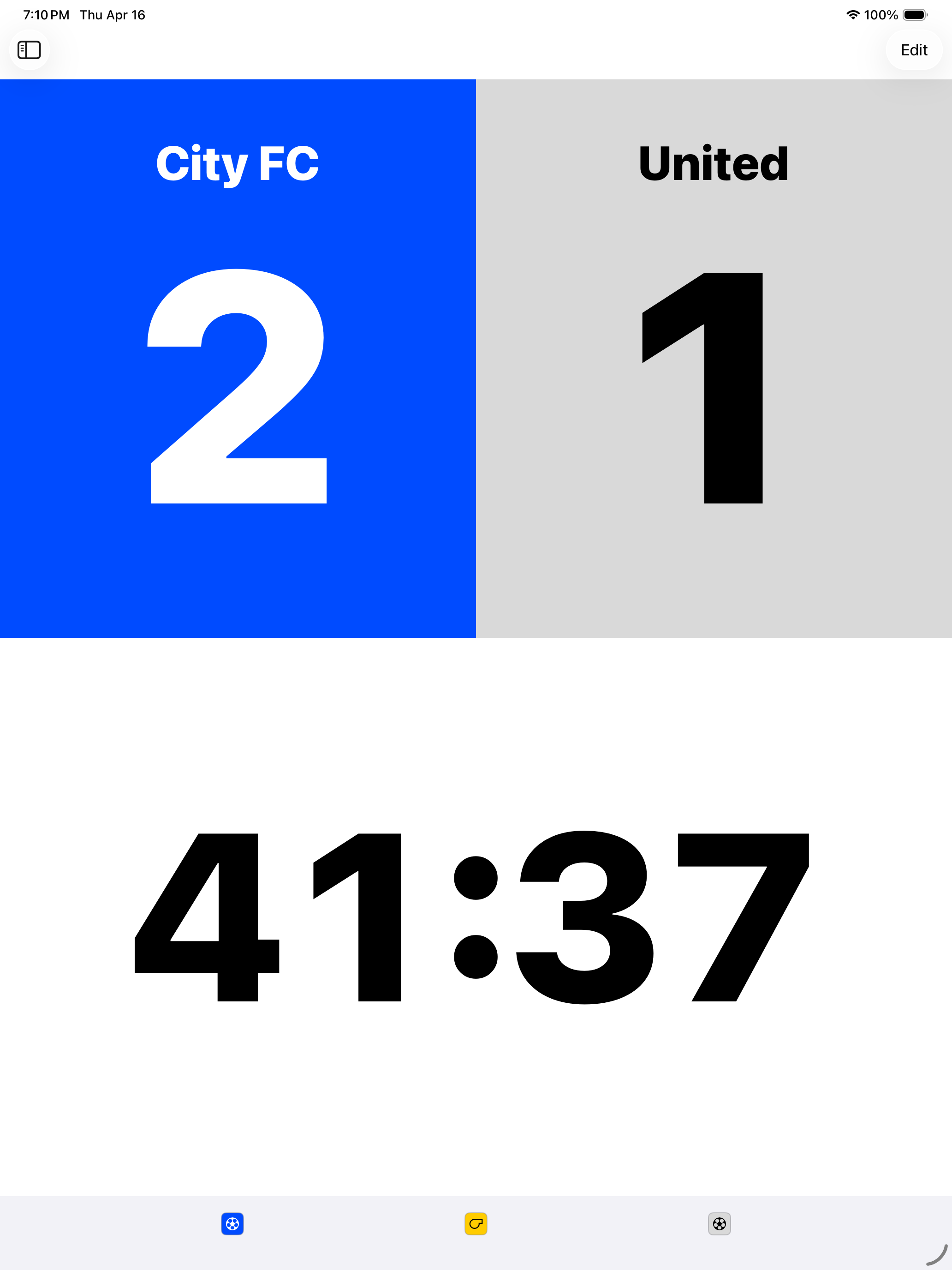 Scoreboard in portrait with a 2–1 scoreline and control strip visible